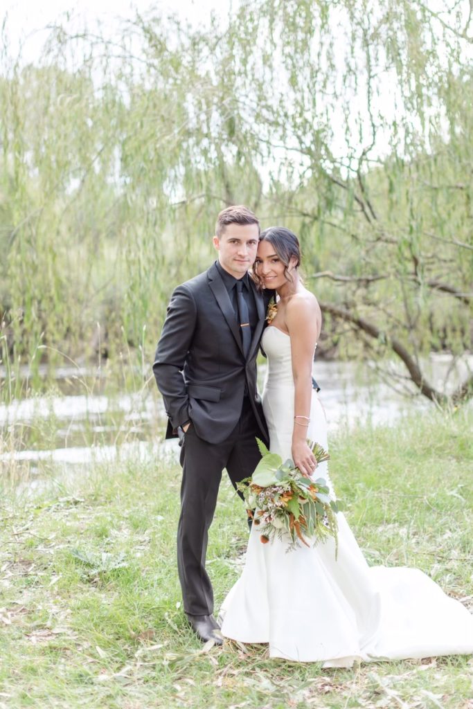 Groom and bride in wedding dress with sleeves removed