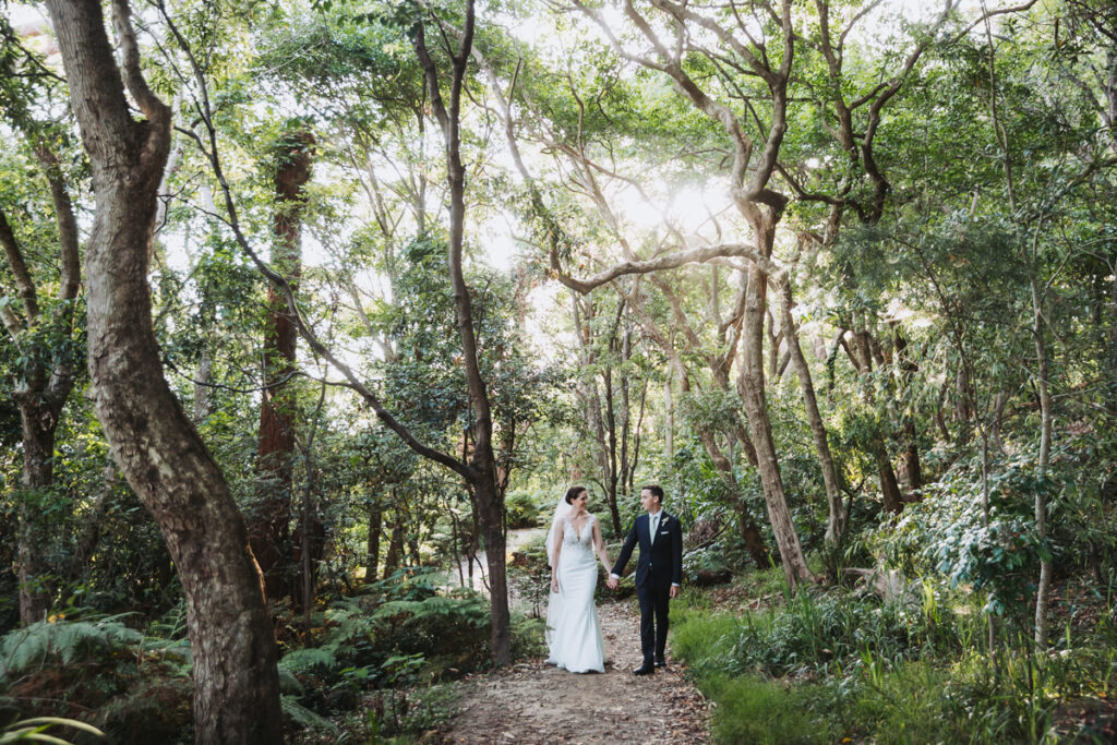 Bridal couple walking in the woods