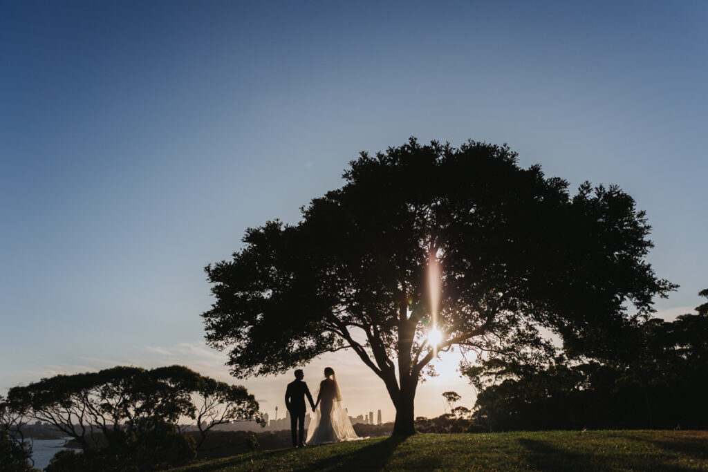 Silhouette of couple against sun