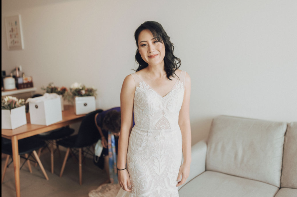 Bride in wedding dress altered by Sarah Tai Bridal Alterations