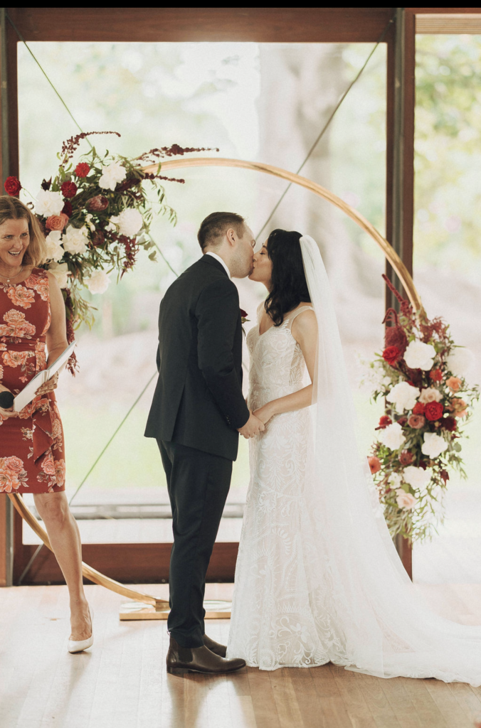 Couple kissing at altar