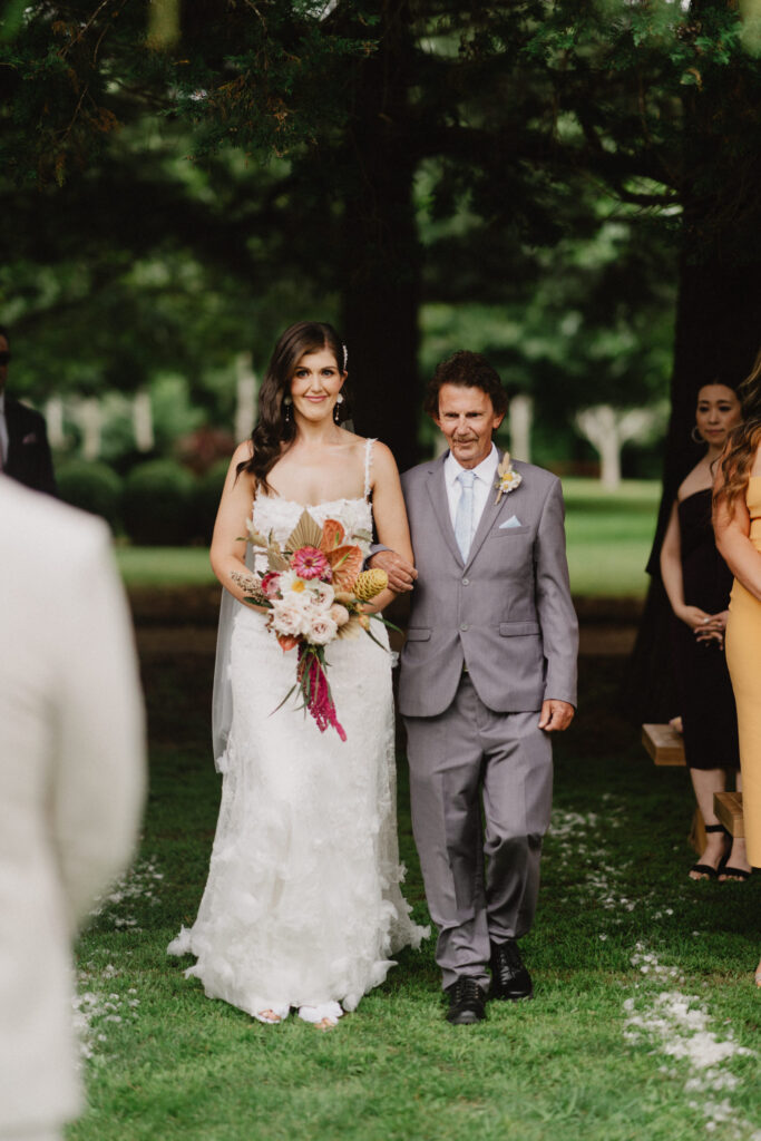 Bride walking down the aisle with her dad