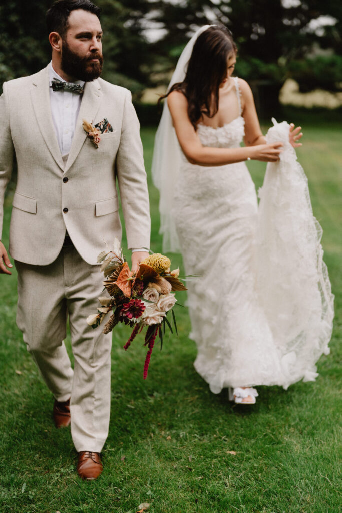 Bridal couple walking in garden