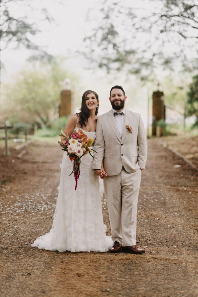 Bridal couple standing in driveway